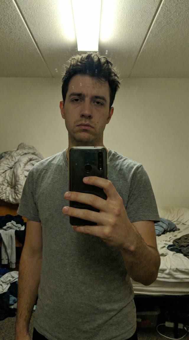 Dating profile photo before AI enhancement - casual selfie