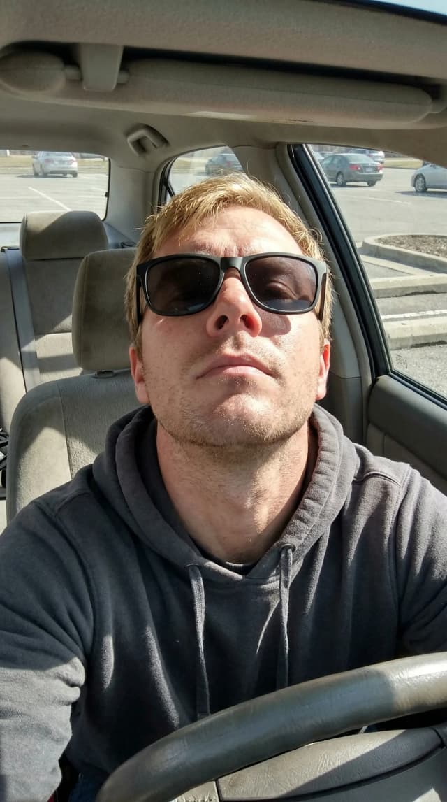 Dating profile photo before AI enhancement - casual selfie